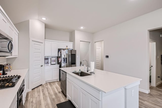 1211 Caddo Hill Ct, Royse City, TX 75189 - kitchen featuring stainless steel appliances, a sink, light wood-style floors, light countertops, and recessed lighting
