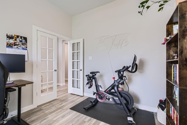 1211 Caddo Hill Ct, Royse City, TX 75189 - exercise area featuring french doors, wood finished floors, and baseboards