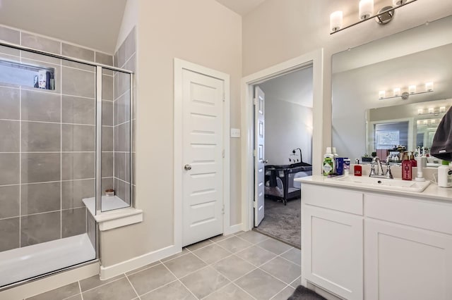 1211 Caddo Hill Ct, Royse City, TX 75189 - bathroom featuring tiled shower, vanity, tile patterned floors, and baseboards