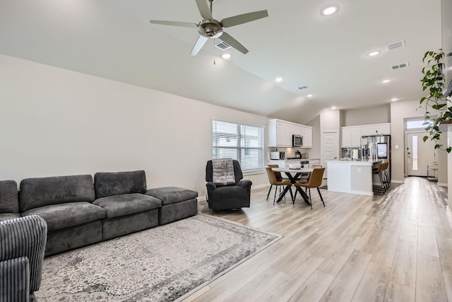 1211 Caddo Hill Ct, Royse City, TX 75189 - living room featuring vaulted ceiling, light wood-style flooring, recessed lighting, a ceiling fan, and baseboards