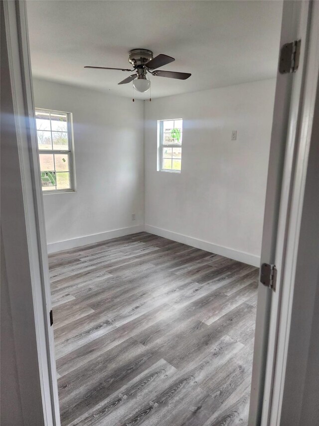 1178 Nob Hill Rd, Quinlan, TX 75474 - spare room with wood finished floors, a ceiling fan, and baseboards