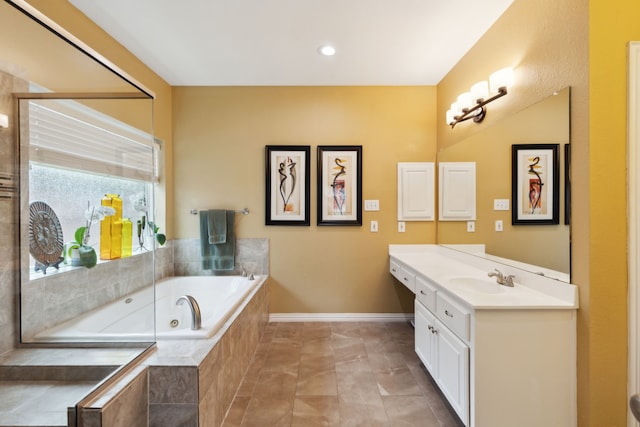 6308 Widgeon Dr, Plano, TX 75024 - full bathroom featuring vanity, a jetted tub, and baseboards