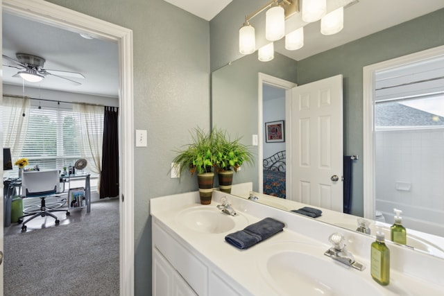 6308 Widgeon Dr, Plano, TX 75024 - full bathroom with double vanity, ceiling fan, a textured wall, and a bath