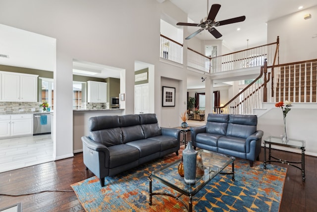 6308 Widgeon Dr, Plano, TX 75024 - living area with wood-type flooring, healthy amount of natural light, a ceiling fan, a towering ceiling, and recessed lighting