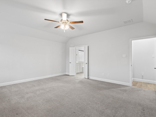 2508 Bunker Hill Dr, Burleson, TX 76028 - unfurnished bedroom with vaulted ceiling, light colored carpet, baseboards, connected bathroom, and a ceiling fan