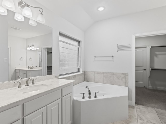 2508 Bunker Hill Dr, Burleson, TX 76028 - bathroom featuring vanity, a garden tub, recessed lighting, and lofted ceiling