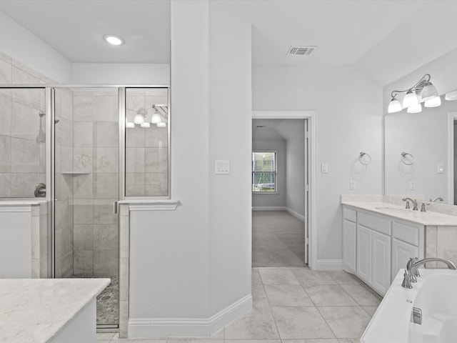 2508 Bunker Hill Dr, Burleson, TX 76028 - full bathroom featuring vanity, a stall shower, a tub, baseboards, and tile patterned floors