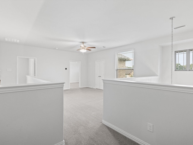 2508 Bunker Hill Dr, Burleson, TX 76028 - unfurnished room featuring light colored carpet, ceiling fan, healthy amount of natural light, and baseboards