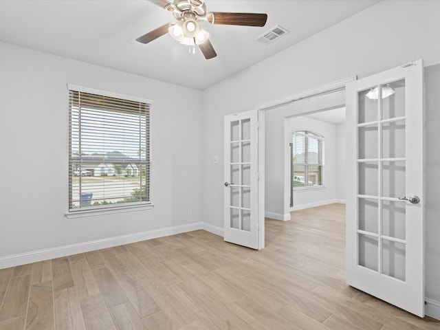 2508 Bunker Hill Dr, Burleson, TX 76028 - unfurnished room featuring french doors, light wood-style flooring, baseboards, and ceiling fan