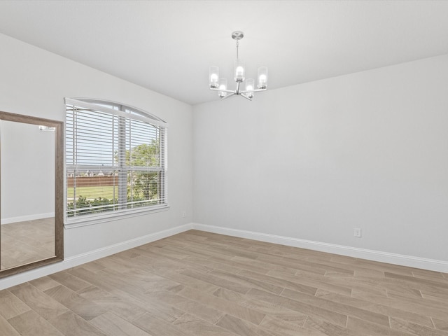 2508 Bunker Hill Dr, Burleson, TX 76028 - empty room with a chandelier, light wood-style flooring, and baseboards