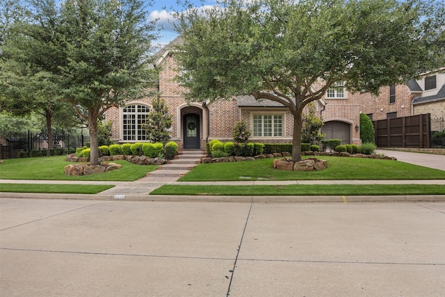 8249 Treemont Pl, Frisco, TX 75034 - view of front of house featuring brick siding, driveway, and a garage