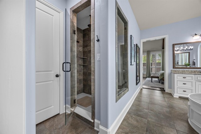 8249 Treemont Pl, Frisco, TX 75034 - full bathroom with a shower stall, vanity, baseboards, and ensuite bathroom