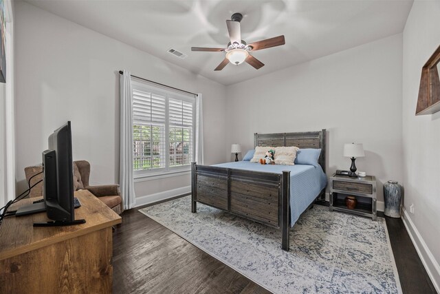 8249 Treemont Pl, Frisco, TX 75034 - bedroom featuring wood finished floors, baseboards, and a ceiling fan