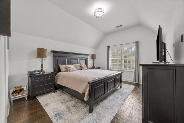 8249 Treemont Pl, Frisco, TX 75034 - bedroom with lofted ceiling and wood finished floors