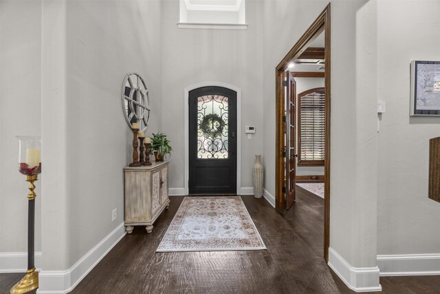 8249 Treemont Pl, Frisco, TX 75034 - entrance foyer featuring dark wood finished floors and baseboards