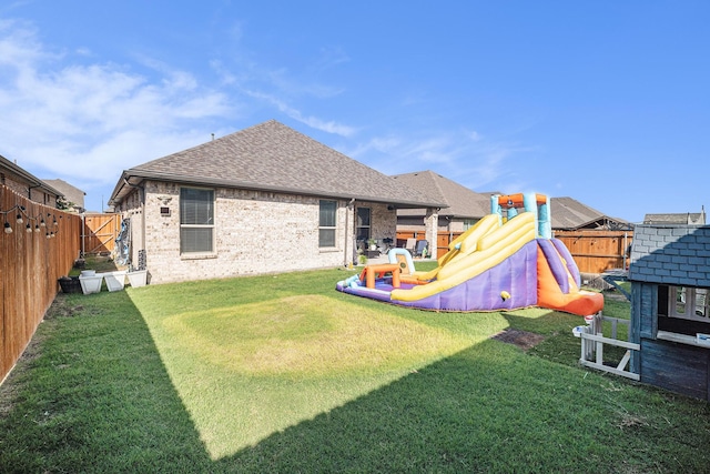 117 Welch Folly Ln, Aledo, TX 76008 - back of house with a playground, a fenced backyard, a shingled roof, and brick siding