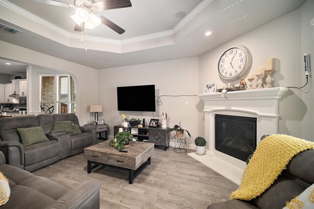 117 Welch Folly Ln, Aledo, TX 76008 - living area featuring a raised ceiling, light wood-type flooring, recessed lighting, ceiling fan, and ornamental molding