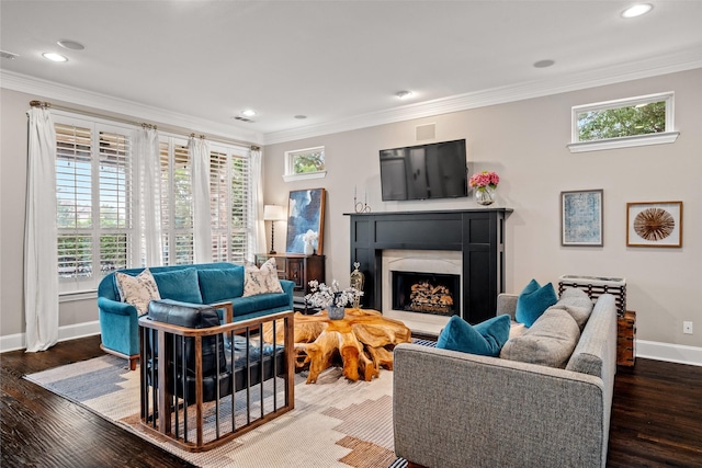 7905 Strathmill Dr, The Colony, TX 75056 - living room with baseboards, a fireplace with raised hearth, crown molding, wood finished floors, and recessed lighting