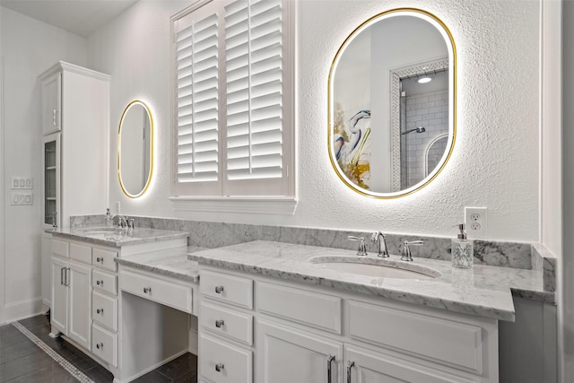 7905 Strathmill Dr, The Colony, TX 75056 - bathroom featuring double vanity and a textured wall