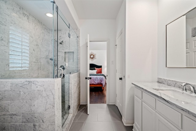 7905 Strathmill Dr, The Colony, TX 75056 - ensuite bathroom with vanity, a shower stall, and tile patterned flooring