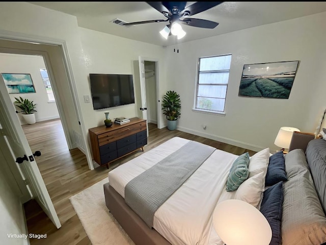 126 Stephens St, Waxahachie, TX 75165 - bedroom with multiple windows, wood finished floors, and baseboards