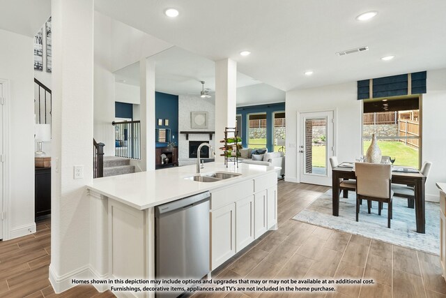 3418 Abingdon Dr, Melissa, TX 75454 - kitchen featuring dishwasher, a sink, light wood finished floors, open floor plan, and baseboards