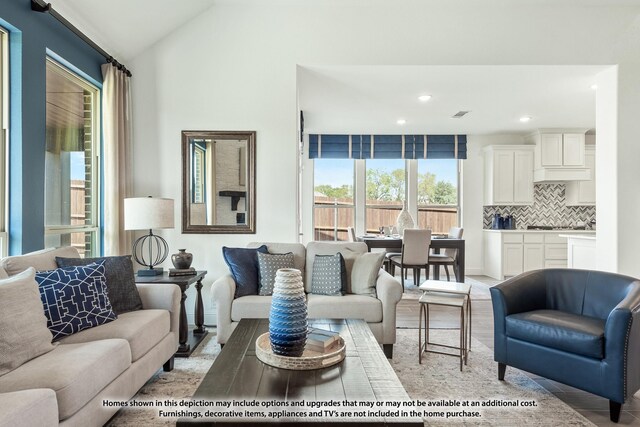 3418 Abingdon Dr, Melissa, TX 75454 - living area featuring recessed lighting, light wood finished floors, lofted ceiling, and baseboards