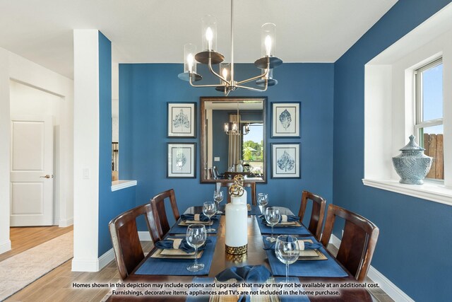 3418 Abingdon Dr, Melissa, TX 75454 - dining room featuring a chandelier, healthy amount of natural light, wood finished floors, and baseboards