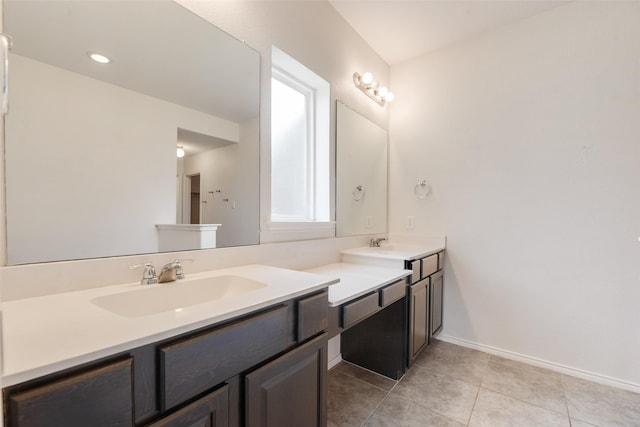 1503 E Collins Blvd, Wylie, TX 75098 - bathroom with double vanity, tile patterned floors, and baseboards