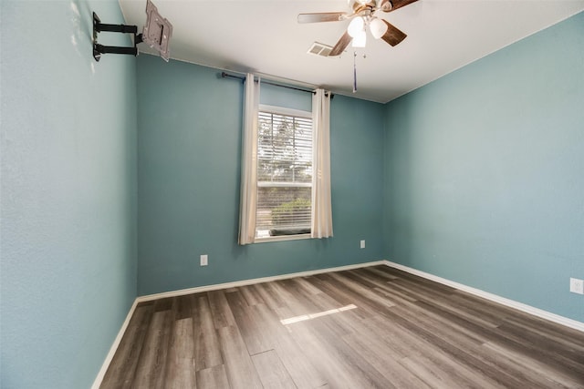 1503 E Collins Blvd, Wylie, TX 75098 - empty room featuring a ceiling fan, wood finished floors, and baseboards