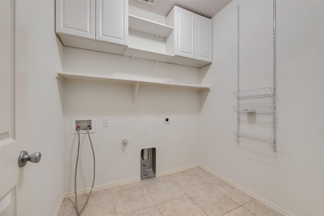 1503 E Collins Blvd, Wylie, TX 75098 - washroom featuring cabinet space, hookup for a washing machine, hookup for an electric dryer, light tile patterned flooring, and baseboards