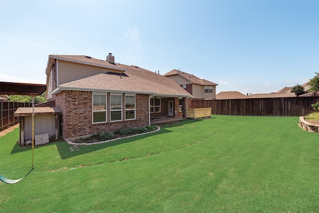 1503 E Collins Blvd, Wylie, TX 75098 - rear view of property with brick siding, a shingled roof, and a chimney