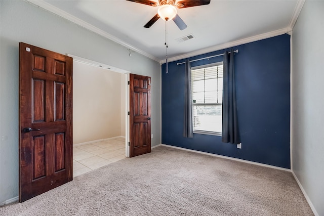 1503 E Collins Blvd, Wylie, TX 75098 - spare room featuring carpet flooring, ornamental molding, ceiling fan, baseboards, and tile patterned flooring