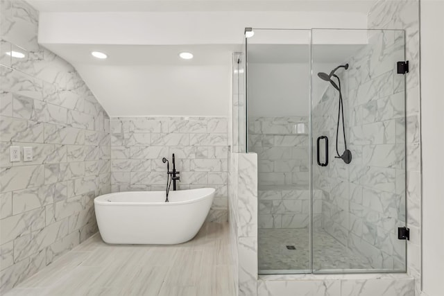 783 Eiffel Dr, Plano, TX 75023 - bathroom featuring a shower stall, a soaking tub, recessed lighting, tile walls, and marble finish flooring