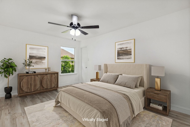 783 Eiffel Dr, Plano, TX 75023 - bedroom with baseboards, wood finished floors, and ceiling fan