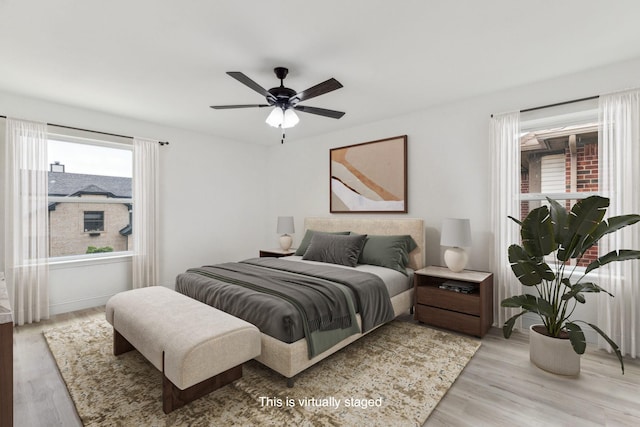 783 Eiffel Dr, Plano, TX 75023 - bedroom with light wood finished floors and ceiling fan