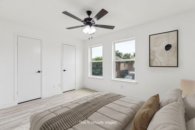 783 Eiffel Dr, Plano, TX 75023 - bedroom with wood finished floors, baseboards, and a ceiling fan
