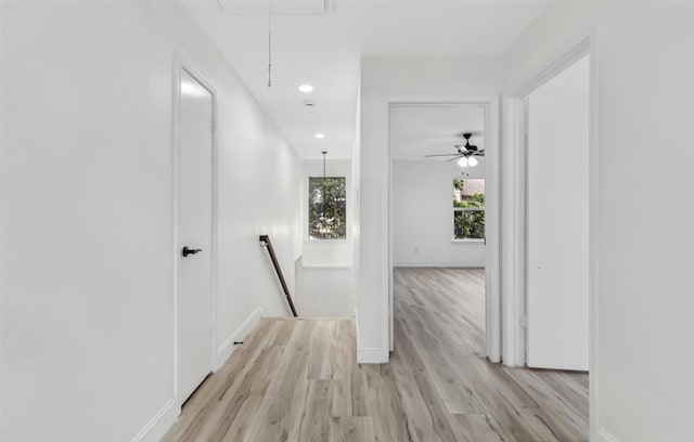 783 Eiffel Dr, Plano, TX 75023 - hall with attic access, an upstairs landing, light wood finished floors, baseboards, and recessed lighting