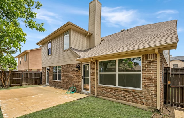 783 Eiffel Dr, Plano, TX 75023 - rear view of house featuring a chimney, brick siding, a patio area, and a shingled roof