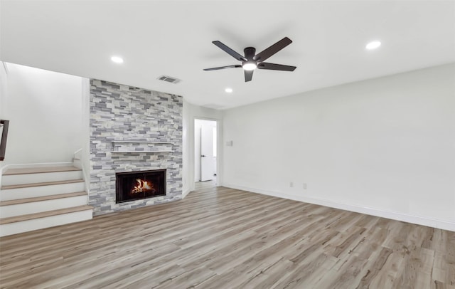 783 Eiffel Dr, Plano, TX 75023 - unfurnished living room with wood finished floors, a ceiling fan, recessed lighting, stairway, and a fireplace
