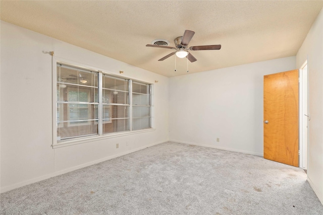 201 Palestine St, Coleman, TX 76834 - empty room featuring carpet, ceiling fan, a textured ceiling, and baseboards