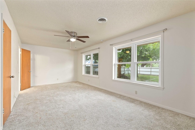 201 Palestine St, Coleman, TX 76834 - carpeted empty room with ceiling fan and a textured ceiling