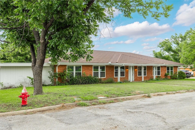201 Palestine St, Coleman, TX 76834 - single story home with a front yard and brick siding