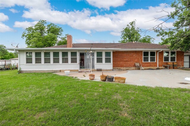 201 Palestine St, Coleman, TX 76834 - rear view of house with a patio, a chimney, and a yard
