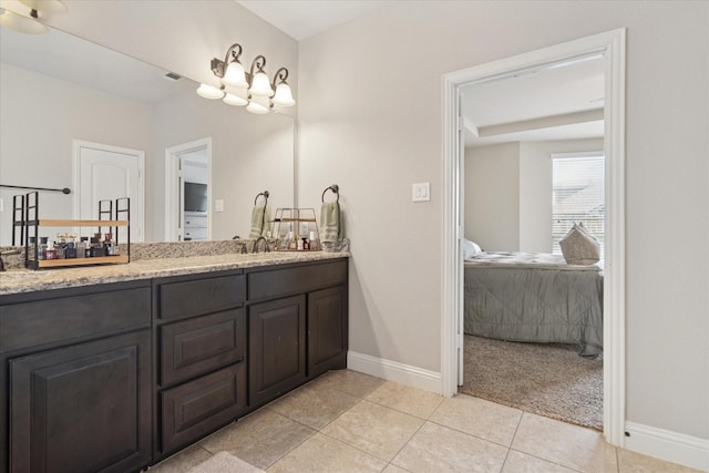 3302 Blue Jay Ln, Melissa, TX 75454 - bathroom with double vanity, baseboards, and tile patterned floors