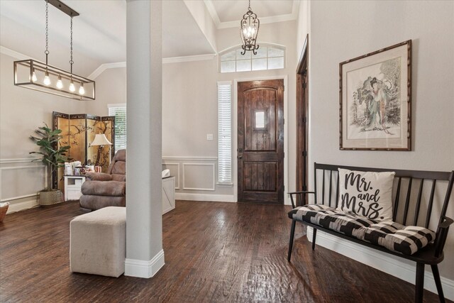3302 Blue Jay Ln, Melissa, TX 75454 - entrance foyer featuring crown molding, a chandelier, wood finished floors, a wainscoted wall, and a decorative wall