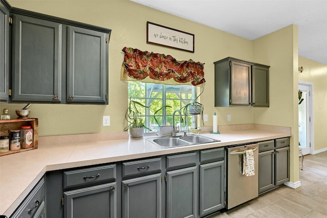 1908 Timberline Ln, Sherman, TX 75092 - kitchen featuring a sink, stainless steel dishwasher, light countertops, light tile patterned flooring, and gray cabinetry