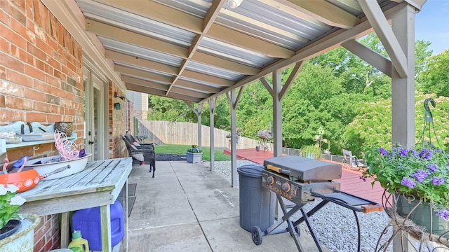 1908 Timberline Ln, Sherman, TX 75092 - view of patio with outdoor dining area and a wooden deck