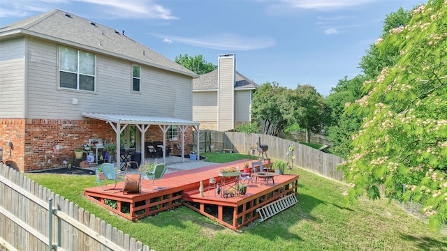 1908 Timberline Ln, Sherman, TX 75092 - back of property with brick siding, a deck, and roof with shingles