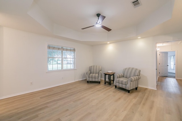 1503 County Road 705, Joshua, TX 76058 - sitting room featuring a ceiling fan, light wood-style flooring, baseboards, attic access, and a raised ceiling